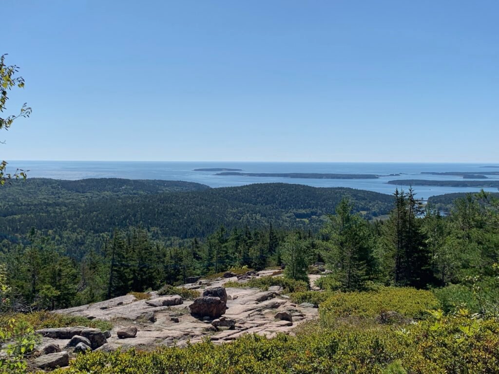 A clear September day overlooking forests and water in Acadia National Park